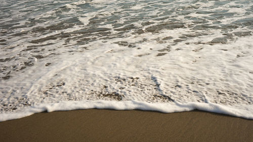 High angle view of surf on beach