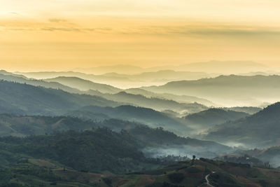 Scenic view of mountains against sky during sunset