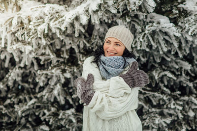 Portrait of young woman in snow