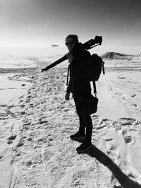 Full length of man standing on beach