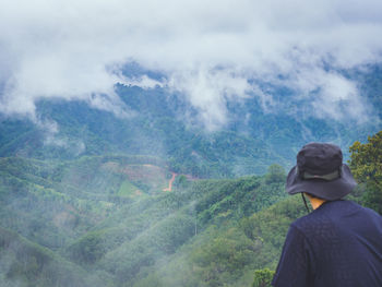 Rear view of man looking at mountain