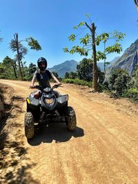 Man riding motorcycle on road