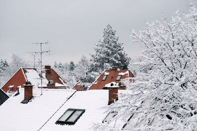Houses against clear sky during winter