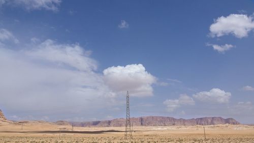 Scenic view of arid landscape against sky