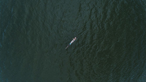 High angle view of person on rowboat in sea