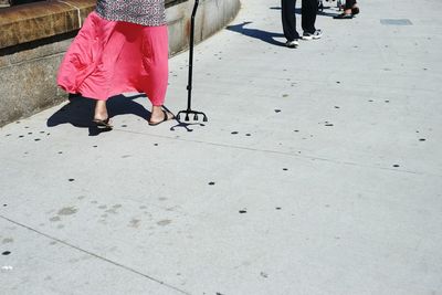 Low section of woman standing on tiled floor