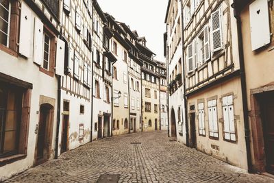 Narrow alley amidst buildings in town