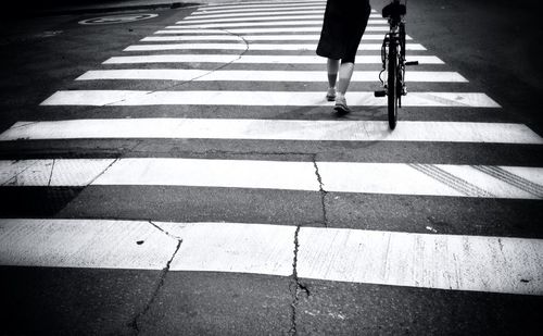 Low section of people walking on road