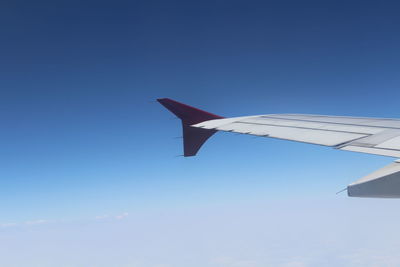 Low angle view of airplane flying in sky