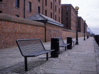 Empty seats against buildings