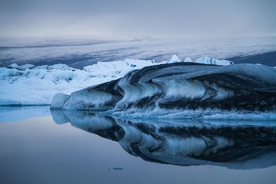 Scenic view of frozen sea against sky