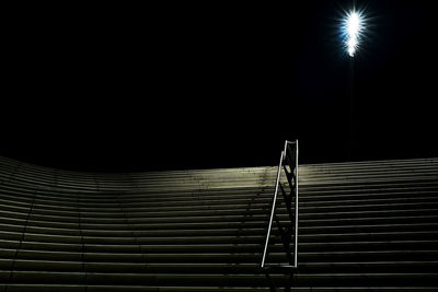 Low angle view of illuminated staircase at night