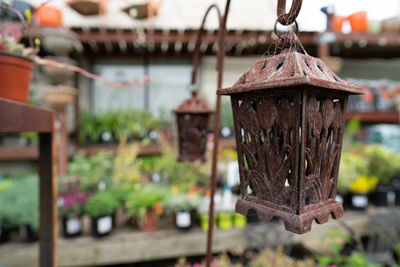 Close-up of birdhouse on roof against building