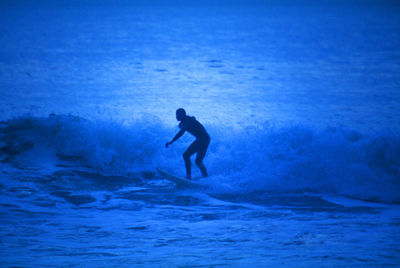 People surfing in sea