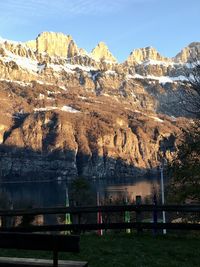 Scenic view of lake and mountains against sky