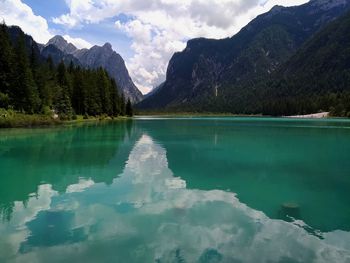 Scenic view of lake and mountains against sky