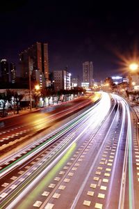High angle view of light trails on road at night