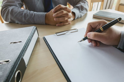 Close-up of man working on table