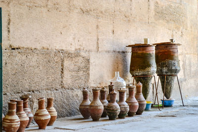 Row of old bottles on wall