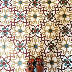 Low section of person standing on tiled floor