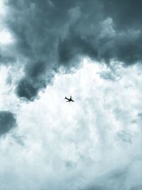 Low angle view of airplane in sky