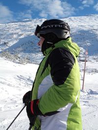 Man skiing on snowcapped mountain