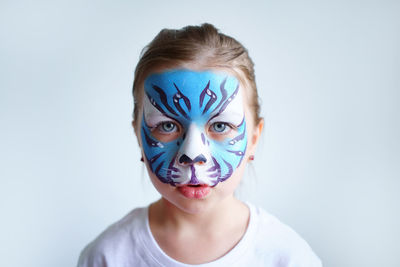 Girl aqua makeup in the form of a blue water tiger zodiac on, new year 2022, sad portrait.