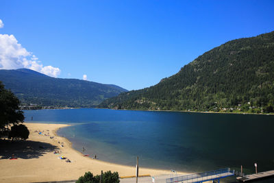Scenic view of mountains against blue sky