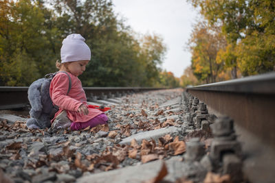 Full length of baby boy on railroad track