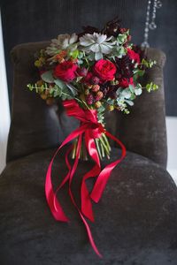 Close-up of red flower on table