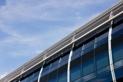 Low angle view of building against cloudy sky