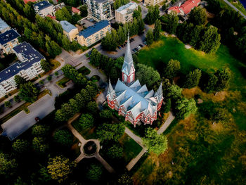 High angle view of trees and buildings in city