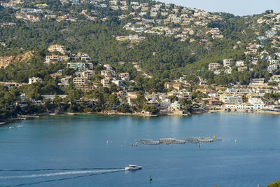 High angle view of buildings by sea