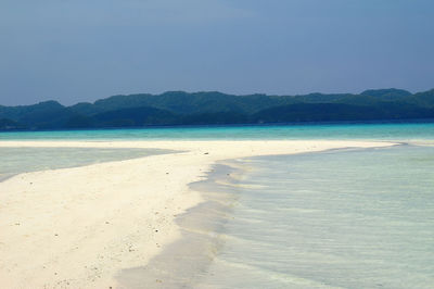 Scenic view of beach against clear sky