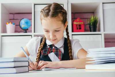 Girl sitting on table