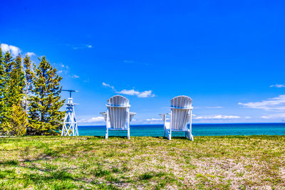 Scenic view of beach against blue sky