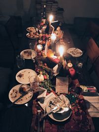 High angle view of illuminated candles on table