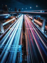 High angle view of light trails on road at night