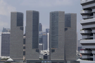 Modern buildings in city against sky