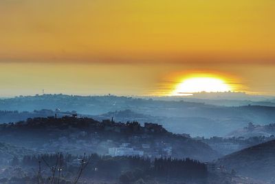 Scenic view of silhouette landscape against sky during sunset