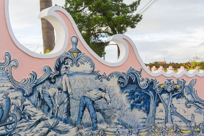 Panoramic view of carousel against sky