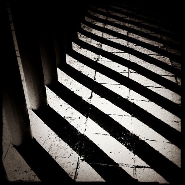 steps, shadow, indoors, steps and staircases, staircase, railing, sunlight, pattern, high angle view, built structure, the way forward, wall - building feature, architecture, no people, empty, stairs, in a row, day, auto post production filter, diminishing perspective