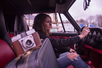 Woman sitting in car