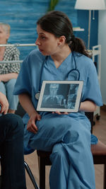 Doctor holding digital tablet in clinic