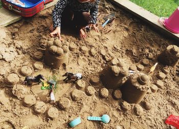 High angle view of children playing on sand at beach