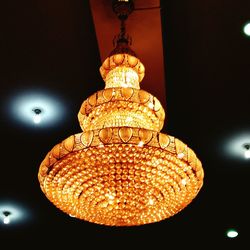 Low angle view of illuminated chandelier
