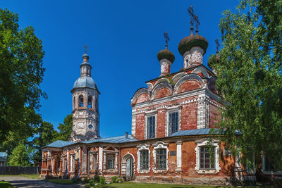 Low angle view of building against blue sky