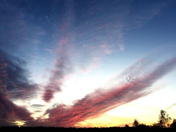 Low angle view of dramatic sky during sunset