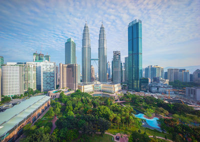 Panoramic view of buildings in city against sky