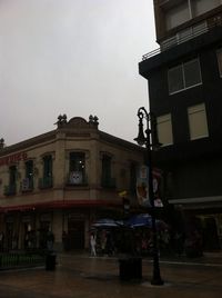 Buildings in city against sky